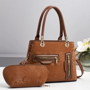 Brown snakeskin embossed Boston handbag set with gold hardware and stylish flower decor