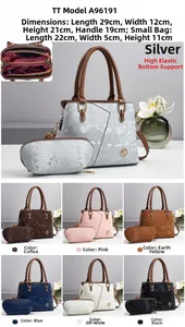 Detailed interior of snakeskin-embossed Boston bag with multiple pockets and small pouch