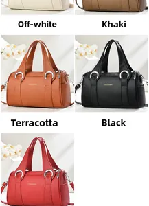 Detail view of pillow handbag available in beige, khaki, yellow, black and red colors