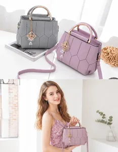 Detail showing honeycomb quilted faux leather and round metal handle of women's handbag