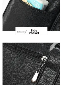 Macro shot of black lychee grain leather handbag with side pocket and metal zipper details