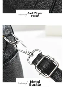 Close-up of black leather handbag with rear zipper pocket and silver metal buckle