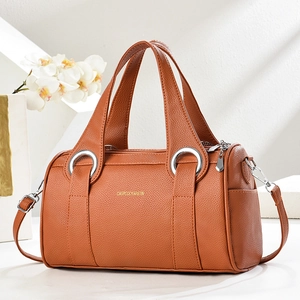 Litchi texture leather pillow handbag in bright orange brown with silver hardware