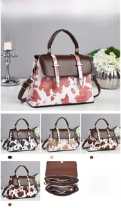 Detailed view of women's vintage cow print crossbody bag with dimensions and interior layout