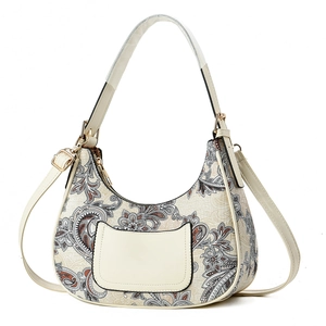 Vintage paisley print hobo handbag with adjustable strap and decorative front pocket