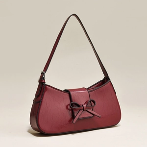 French vintage dark red patent leather underarm bag with decorative bow and slim strap