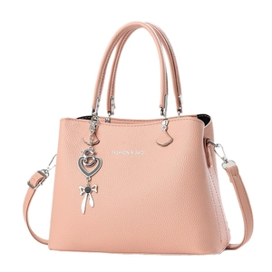 Sac fourre-tout élégant orange-rose à texture litchi avec pendentif en cœur