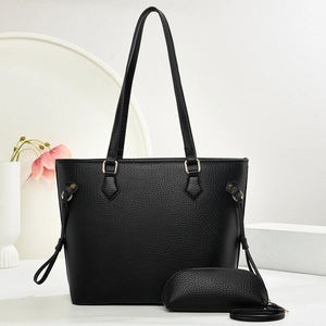 Detail of black lychee grain tote bag set with matching small semi-circular pouch