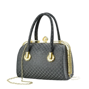 Grey monogram crossbody bag with gold frame, pearl clasp, and metal chain strap