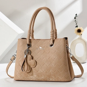 Khaki woven leather tote bag with top handles and flower charm accessory