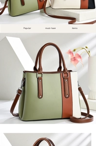 Detail of color-block tote bag with green and white leather and silver hardware rivets