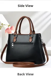 Detail of black faux leather handbag showing the silver back zipper and brown straps
