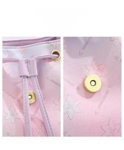 Detail of lavender lilac bucket bag showing magnetic buckle and drawstring closure