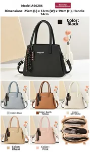 Detailed view of the multi-layer interior and precise dimensions for this shoulder bag