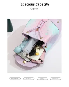Top view of compact gradient backpack showing capacity for phone, tablet, and cosmetics