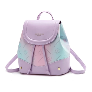 Mini lavender gradient backpack with floral print and gold hardware on white background