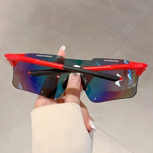 Close-up detail of sporty cycling sunglasses with red frame and rainbow coated lenses