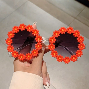 Kids cute flower-shaped sunglasses with orange daisies and purple gradient lenses