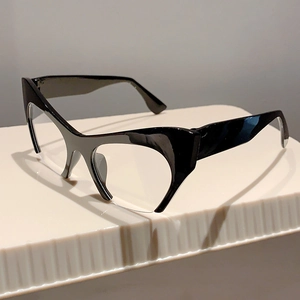 Detail view of glossy black half-rim cat eye glasses with vintage acetate frames