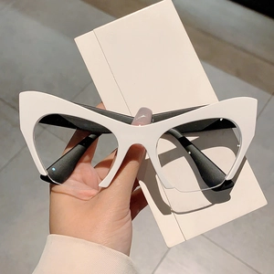 Retro cat-eye half-frame glasses with thick black and white contrast design