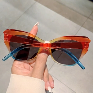 Detail of WF1221 cat-eye sunglasses with gradient orange and blue resin frames