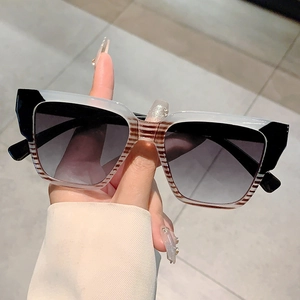 Modern oversized square sunglasses with two-tone frame and grey gradient lenses
