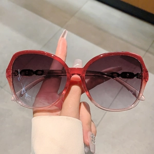 Chic oversized sunglasses with transparent red frames and gradient lenses for women