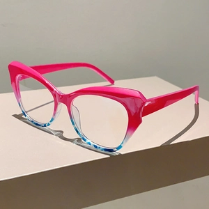 Detailed macro view of cat-eye glasses frame with pink and tortoiseshell resin textures
