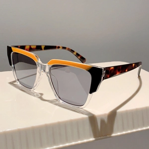 Women's trendy two-tone sunglasses with orange accents and tortoiseshell temples