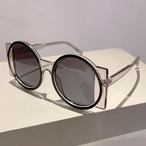 Detail of deconstructed double-frame sunglasses with round black and square clear frames
