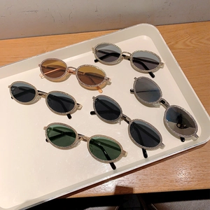 Chic oval sunglasses with rhinestone frames in multiple colors for stylish summer protection