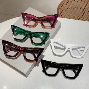Collection of cat eye blue light glasses in pink, tortoise, white and black frames