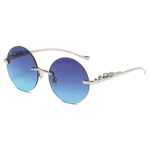 Occhiali da sole rotondi senza montatura con lenti blu sfumate e stanghette a leopardo