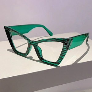 Detailed 45-degree angle of cat-eye glasses with green striped frame and transparent arms