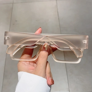 Detail showing square oversized translucent matte frames with integrated nose pads