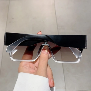 Close-up of square oversized sunglasses with two-tone black and white frames