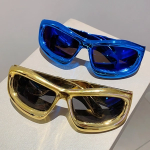 Y2K futuristic oversized sunglasses with metallic blue and gold thick frames