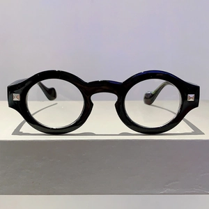 Retro round black frame glasses with silver square rivets and blue light blocking lenses