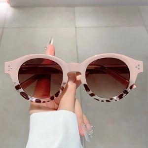 Retro round sunglasses with two-tone beige pink and leopard frames featuring silver accents