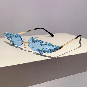 Detail of blue flame shaped rimless sunglasses with sparkling silver glitter accents