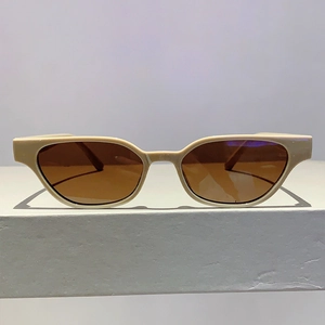 Classic cream cat eye sunglasses for women with retro brown lenses and sleek modern frame