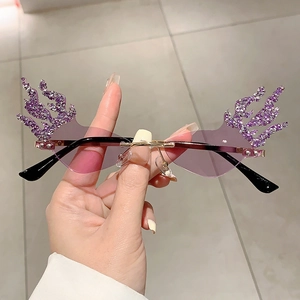Frameless flame shaped sunglasses with purple rhinestones and golden metal temples