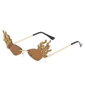 Frameless flame shaped sunglasses with golden metal trim and brown tinted lenses