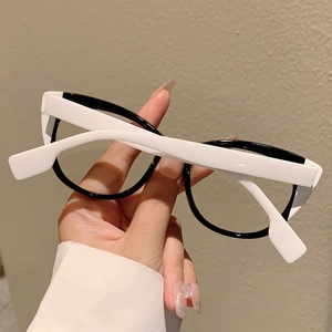 Close-up of stylish black and white contrast frames with thick white temples