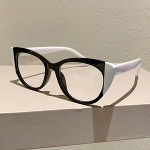 Detailed close-up of retro cat-eye glasses with chic black and white color-block design