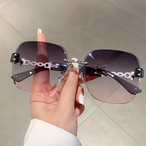 Chic rimless gradient sunglasses with elegant metal chain temples and sparkling rhinestones