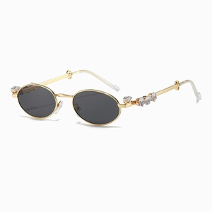 Occhiali da sole ovali vintage con montatura in metallo dorato e strass sulle aste