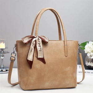 Minimalist khaki shoulder tote bag with silk scarf accent and versatile straps