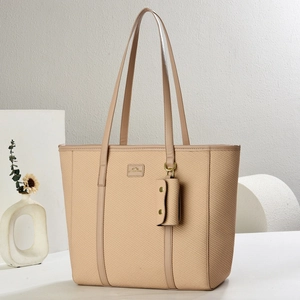 Chic beige woven tote bag with adjustable shoulder strap and mini pouch pendant