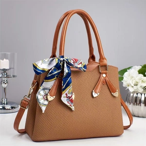 Elegant brown woven leather handbag with silk scarf handle and adjustable crossbody strap
